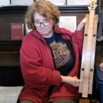 Jayne showing off the dulcimer that Stefan built her.