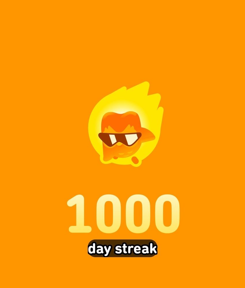 1000 days on Duolingo. Duo the owl is wearing sunglasses and is on fire, but seems to be fine.