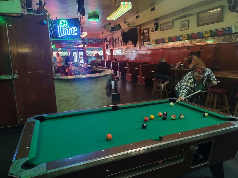 a woman
        plays pool in Pendleton